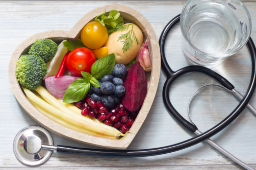 heart shaped bowl with veggies and fruit